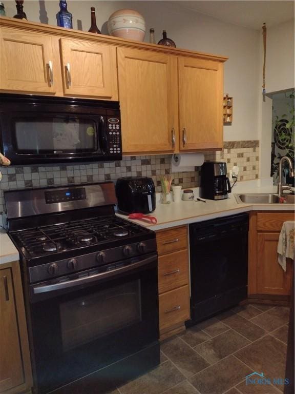 200 Pleasant St, Archbold, OH 43502 - kitchen with black appliances, backsplash, and light countertops