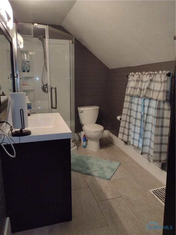 200 Pleasant St, Archbold, OH 43502 - full bath featuring vaulted ceiling, a shower stall, vanity, and tile patterned floors
