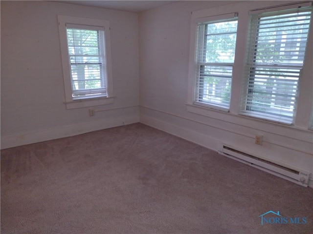 200 Pleasant St, Archbold, OH 43502 - spare room featuring baseboard heating and carpet flooring