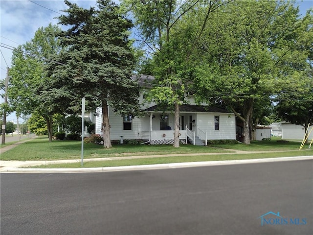 200 Pleasant St, Archbold, OH 43502 - view of front facade featuring a front lawn and a porch