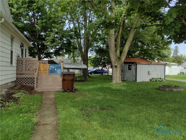 200 Pleasant St, Archbold, OH 43502 - view of green lawn with a shed and a deck