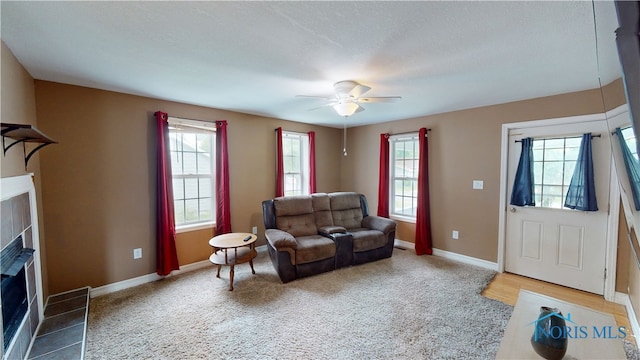 420 Ames St, Clyde, OH 43410 - living room with ceiling fan, a fireplace, and carpet flooring