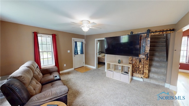 420 Ames St, Clyde, OH 43410 - living area with carpet, ceiling fan, plenty of natural light, and a barn door