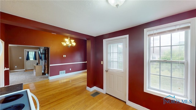 420 Ames St, Clyde, OH 43410 - entryway with a chandelier, healthy amount of natural light, and light wood-style floors