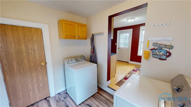 420 Ames St, Clyde, OH 43410 - laundry area featuring washer / dryer, light wood-style floors, and cabinet space