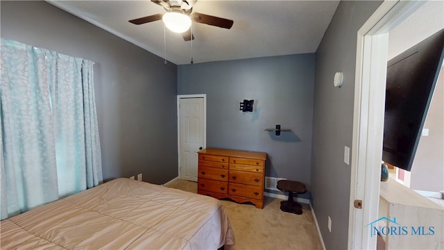 420 Ames St, Clyde, OH 43410 - carpeted bedroom with baseboards and a ceiling fan