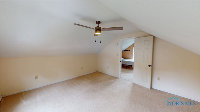 420 Ames St, Clyde, OH 43410 - additional living space with light colored carpet, lofted ceiling, and a ceiling fan