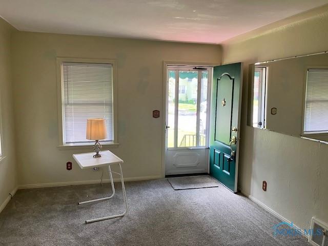4614 290th St, Toledo, OH 43611 - carpeted entrance foyer featuring baseboards