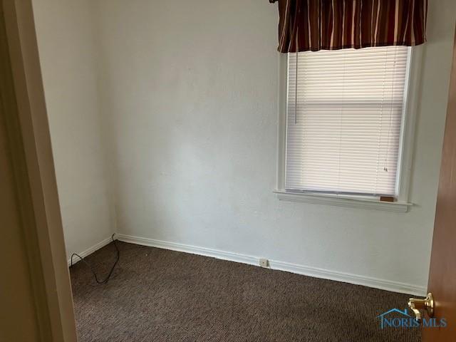 4614 290th St, Toledo, OH 43611 - empty room featuring carpet floors and baseboards