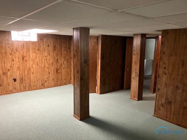 4614 290th St, Toledo, OH 43611 - below grade area featuring carpet, a paneled ceiling, and wood walls