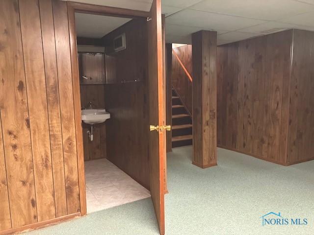4614 290th St, Toledo, OH 43611 - finished below grade area with wood walls, stairs, and carpet floors