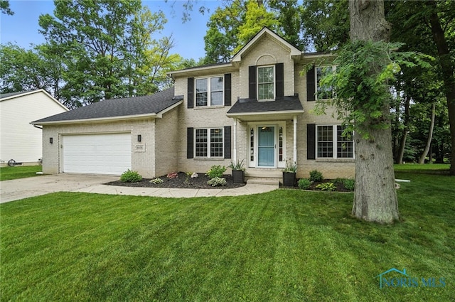 8076 Bridgehampton Dr, Waterville, OH 43566 - view of front of house with brick siding, a garage, driveway, and a front lawn