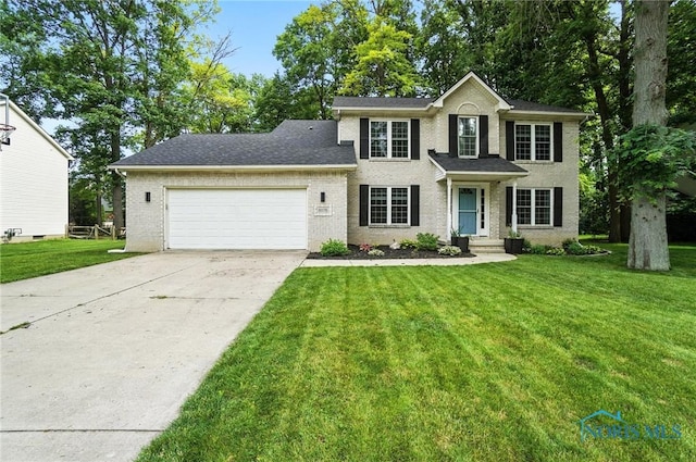 8076 Bridgehampton Dr, Waterville, OH 43566 - colonial inspired home with an attached garage, concrete driveway, a front lawn, and brick siding