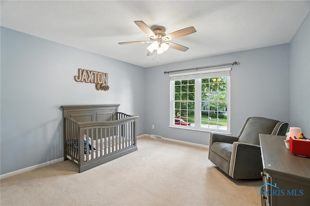 8076 Bridgehampton Dr, Waterville, OH 43566 - carpeted bedroom with a nursery area and a ceiling fan
