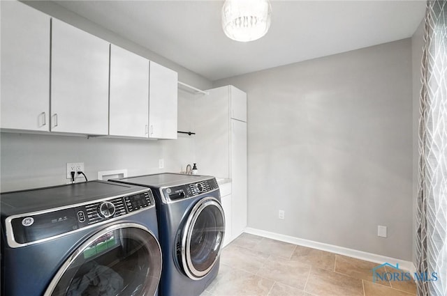 8076 Bridgehampton Dr, Waterville, OH 43566 - washroom with cabinet space, separate washer and dryer, and light tile patterned flooring