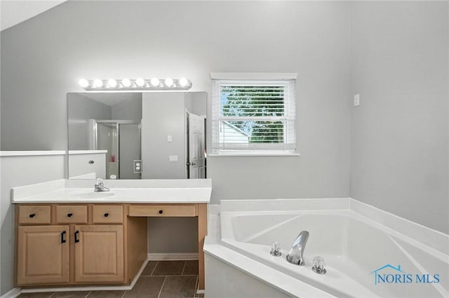 8076 Bridgehampton Dr, Waterville, OH 43566 - full bath featuring vanity, a garden tub, tile patterned flooring, and a stall shower