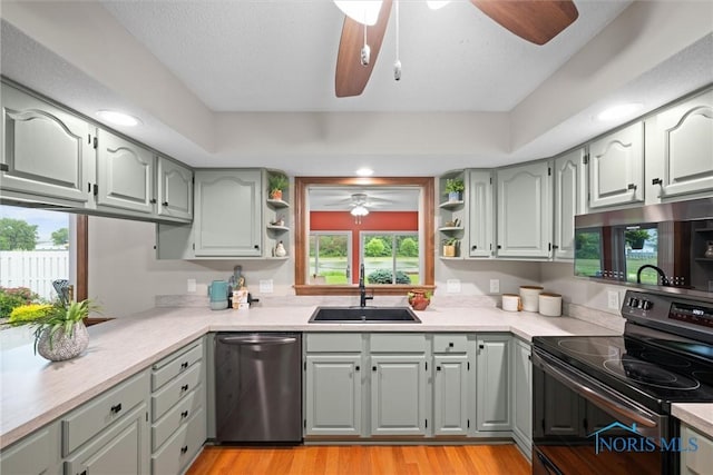 15180 Dirlam Rd, Bowling Green, OH 43402 - kitchen featuring appliances with stainless steel finishes, a ceiling fan, open shelves, gray cabinetry, and recessed lighting
