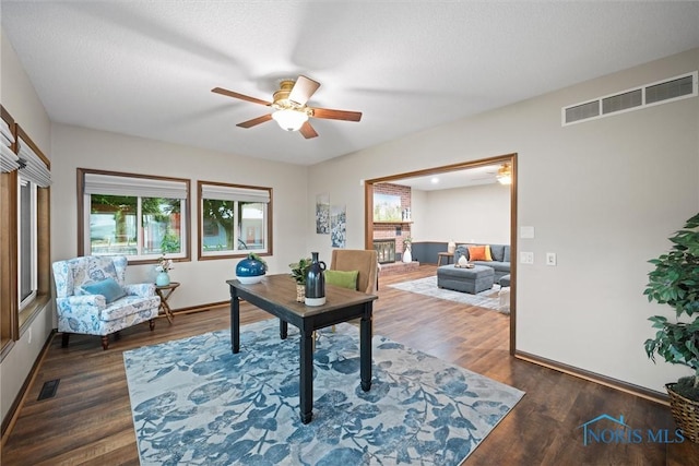 15180 Dirlam Rd, Bowling Green, OH 43402 - home office with healthy amount of natural light, a ceiling fan, and wood finished floors