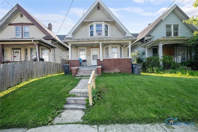 743 Clark St, Toledo, OH 43605 - view of front facade with covered porch and brick siding