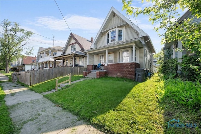 743 Clark St, Toledo, OH 43605 - bungalow featuring covered porch and brick siding