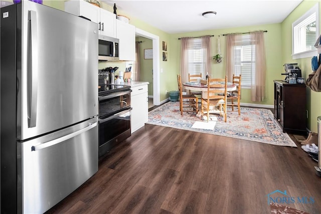 1130 Alger St, Fremont, OH 43420 - dining area with dark wood finished floors and baseboards