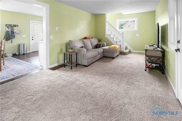 1130 Alger St, Fremont, OH 43420 - carpeted living area with stairs and baseboards
