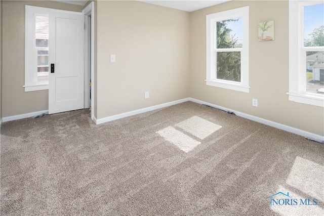 1130 Alger St, Fremont, OH 43420 - carpeted spare room featuring plenty of natural light