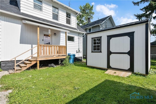 1130 Alger St, Fremont, OH 43420 - rear view of property featuring a yard, a storage shed, and roof with shingles