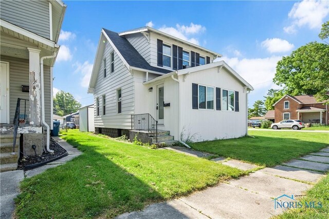 1130 Alger St, Fremont, OH 43420 - view of front of house with a front yard and roof with shingles