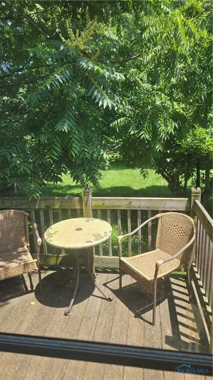 4024 Commonwealth Ave, Toledo, OH 43612 - wooden terrace with outdoor dining area