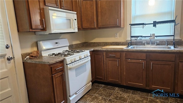 4024 Commonwealth Ave, Toledo, OH 43612 - kitchen with white appliances and dark countertops