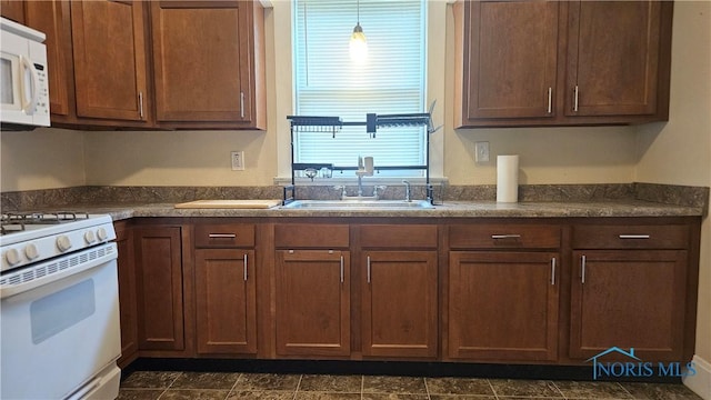 4024 Commonwealth Ave, Toledo, OH 43612 - kitchen featuring white appliances and dark countertops