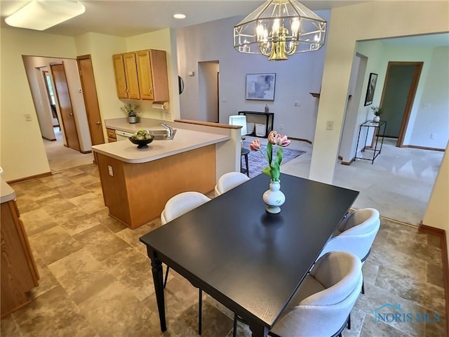 3901 Hampstead Dr Unit 3901, Sylvania, OH 43560 - dining room featuring a chandelier and baseboards