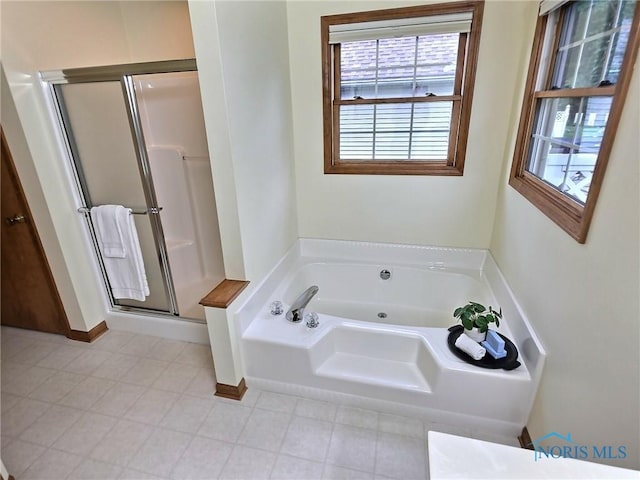3901 Hampstead Dr Unit 3901, Sylvania, OH 43560 - full bathroom featuring a stall shower and a tub with jets