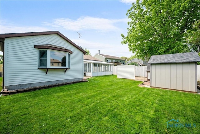 2521 Shallowford Dr, Toledo, OH 43611 - view of yard with a shed and a sunroom