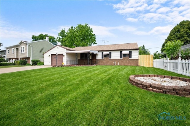 2521 Shallowford Dr, Toledo, OH 43611 - view of front facade featuring concrete driveway, brick siding, and an attached garage
