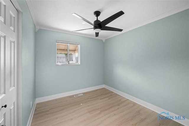 2521 Shallowford Dr, Toledo, OH 43611 - empty room with crown molding, light wood-style floors, and ceiling fan