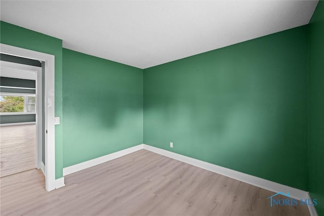 2521 Shallowford Dr, Toledo, OH 43611 - unfurnished room with baseboards and wood finished floors