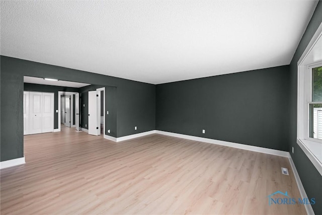 2521 Shallowford Dr, Toledo, OH 43611 - empty room featuring light wood-style flooring and baseboards