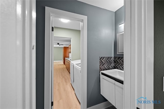 2521 Shallowford Dr, Toledo, OH 43611 - bathroom with separate washer and dryer, vanity, and wood finished floors
