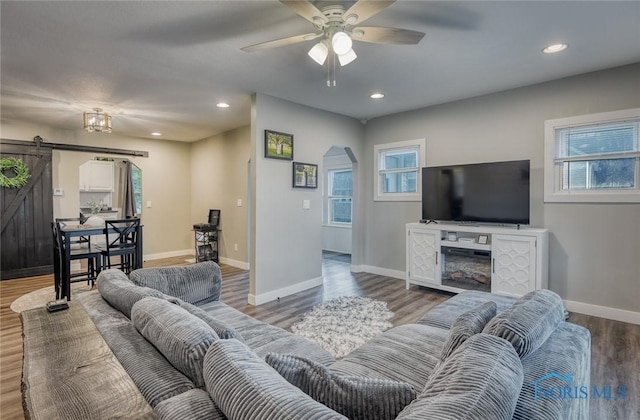 525 Western Ave, Findlay, OH 45840 - living room featuring a barn door, arched walkways, a ceiling fan, wood finished floors, and recessed lighting