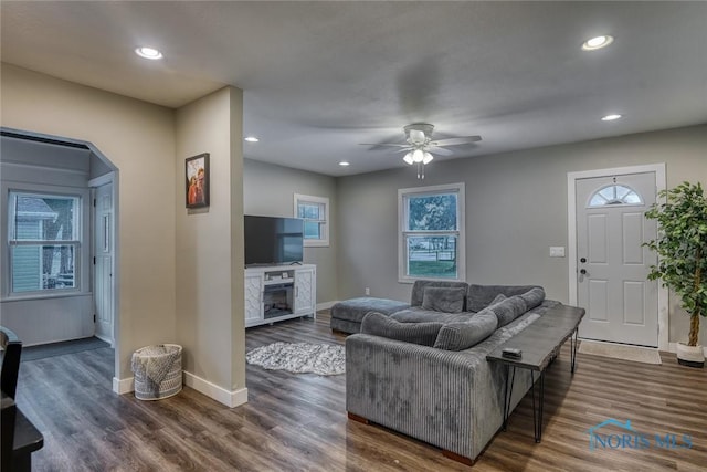 525 Western Ave, Findlay, OH 45840 - living area featuring a ceiling fan, dark wood finished floors, recessed lighting, a fireplace, and arched walkways