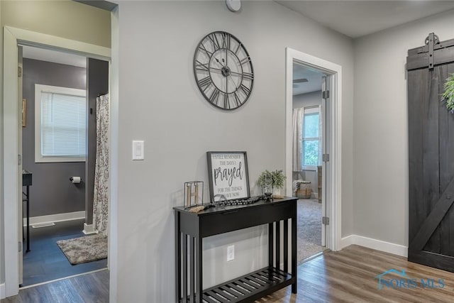 525 Western Ave, Findlay, OH 45840 - entrance foyer featuring a barn door and wood finished floors