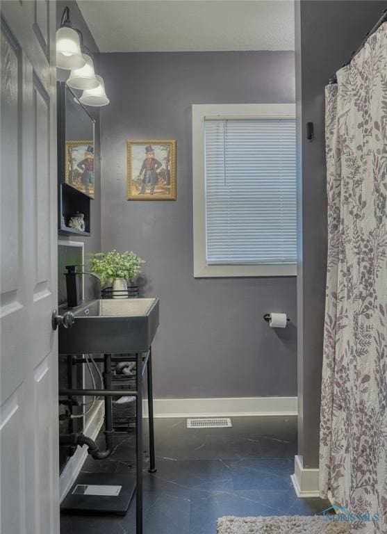 525 Western Ave, Findlay, OH 45840 - bathroom with baseboards and curtained shower