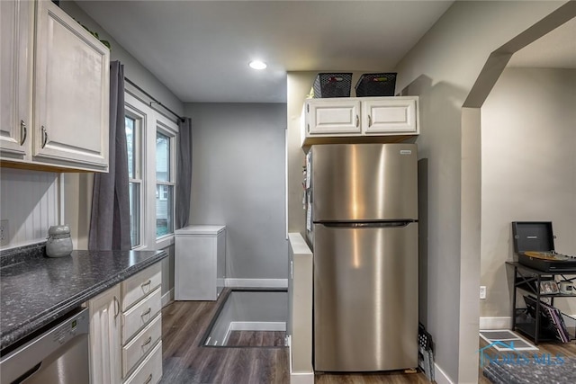 525 Western Ave, Findlay, OH 45840 - kitchen featuring appliances with stainless steel finishes, dark wood-type flooring, white cabinets, dark stone counters, and recessed lighting