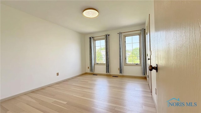 1303 Finch Dr, Bowling Green, OH 43402 - empty room with light wood-style flooring and baseboards