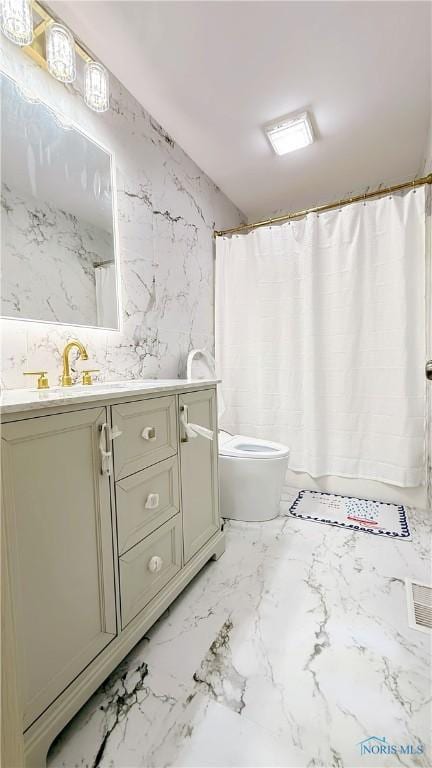 1303 Finch Dr, Bowling Green, OH 43402 - full bathroom with vanity, marble finish floors, and a shower with shower curtain
