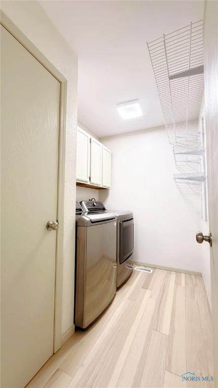 1303 Finch Dr, Bowling Green, OH 43402 - laundry room with washer and dryer and cabinet space