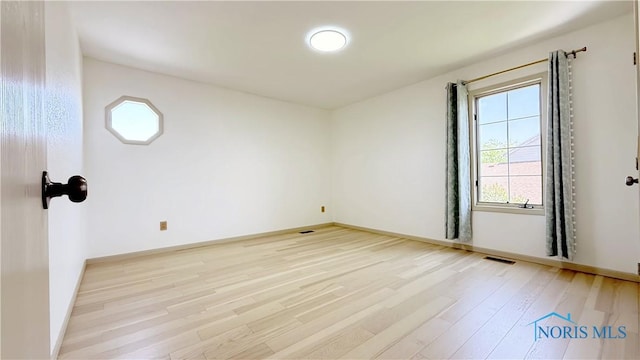 1303 Finch Dr, Bowling Green, OH 43402 - unfurnished room featuring healthy amount of natural light and light wood-style floors