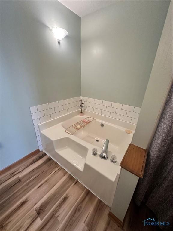1528 Indian Creek Dr, Perrysburg, OH 43551 - bathroom with a bath and wood finished floors